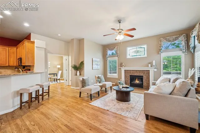 a living room with furniture fireplace and window