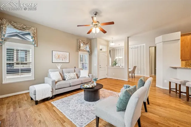 a living room with furniture fireplace and a table