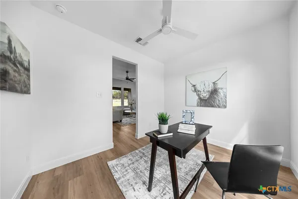 a view of a livingroom with furniture and wooden floor