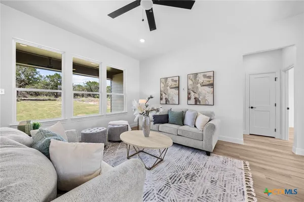 a living room with furniture and windows