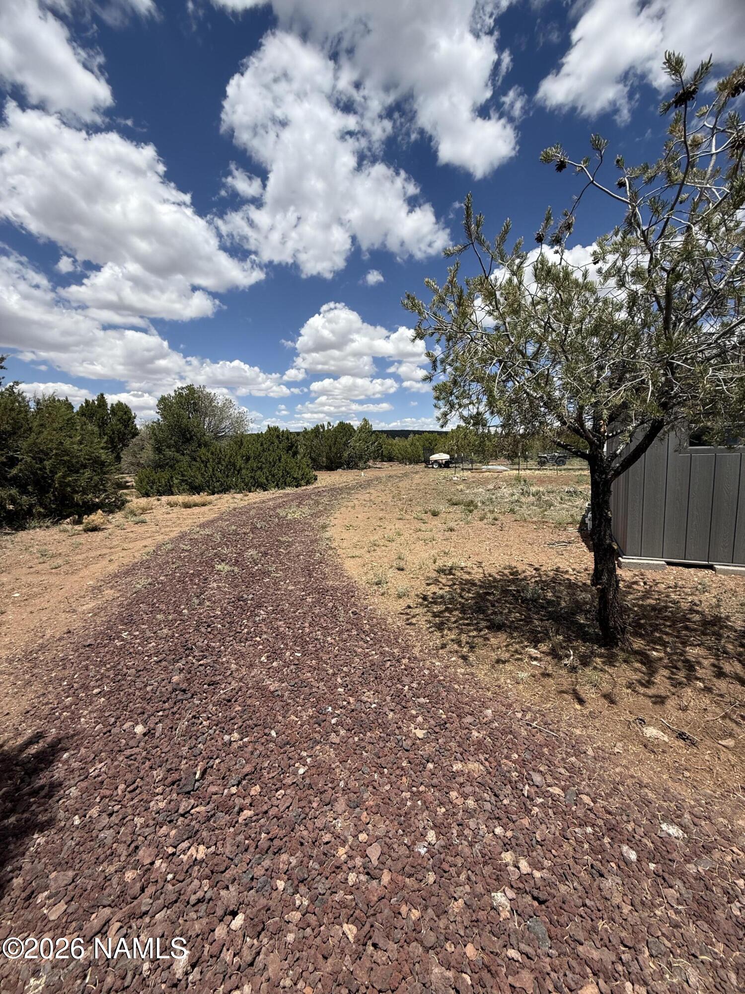 1431 East Cedar Road Williams, AZ 86046 - Photo 36 of 51 a view of a yard with wooden fence