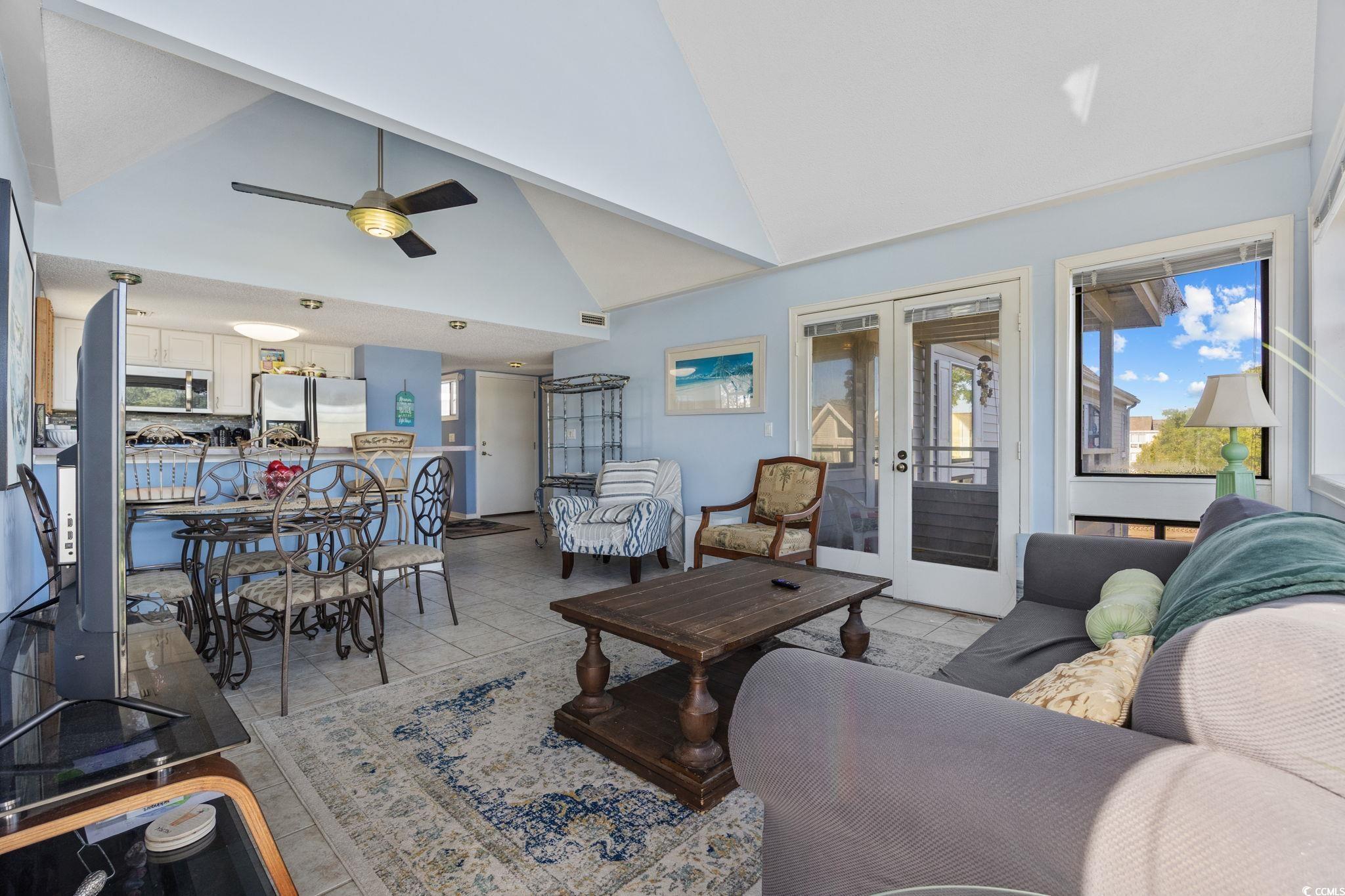 351 Lake Arrowhead Road, Unit 1301 Myrtle Beach, SC 29572 - Photo 13 of 40 Living room featuring plenty of natural light, high vaulted ceiling, ceiling fan, light tile patterned floors, and french doors
