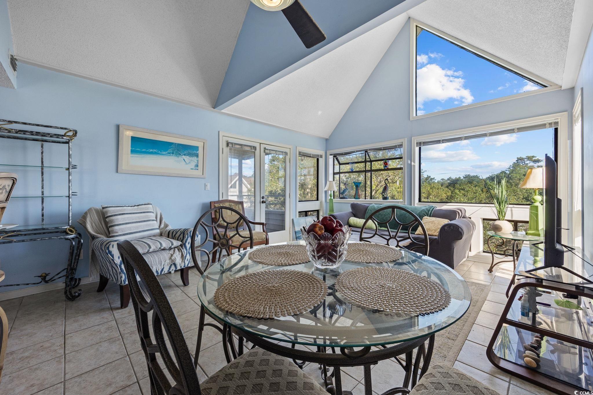 351 Lake Arrowhead Road, Unit 1301 Myrtle Beach, SC 29572 - Photo 4 of 40 Sunroom featuring high vaulted ceiling, french doors, and tile patterned floors