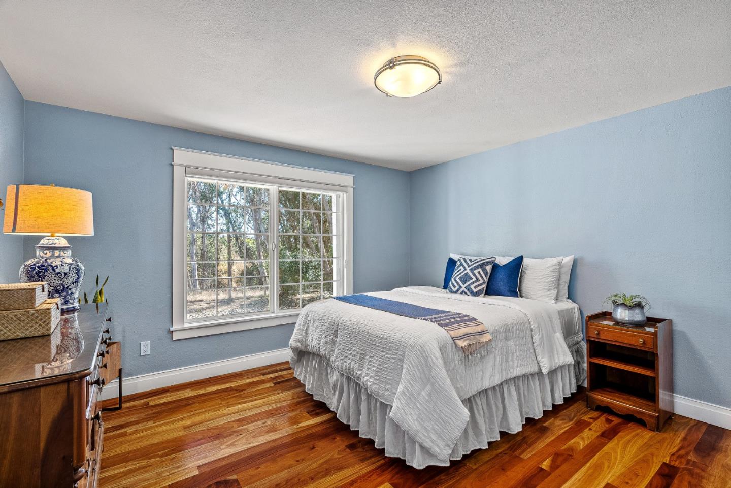 431 Canon Del Sol Watsonville, CA 95076 - Photo 29 of 50 a bedroom with a bed and wooden floor