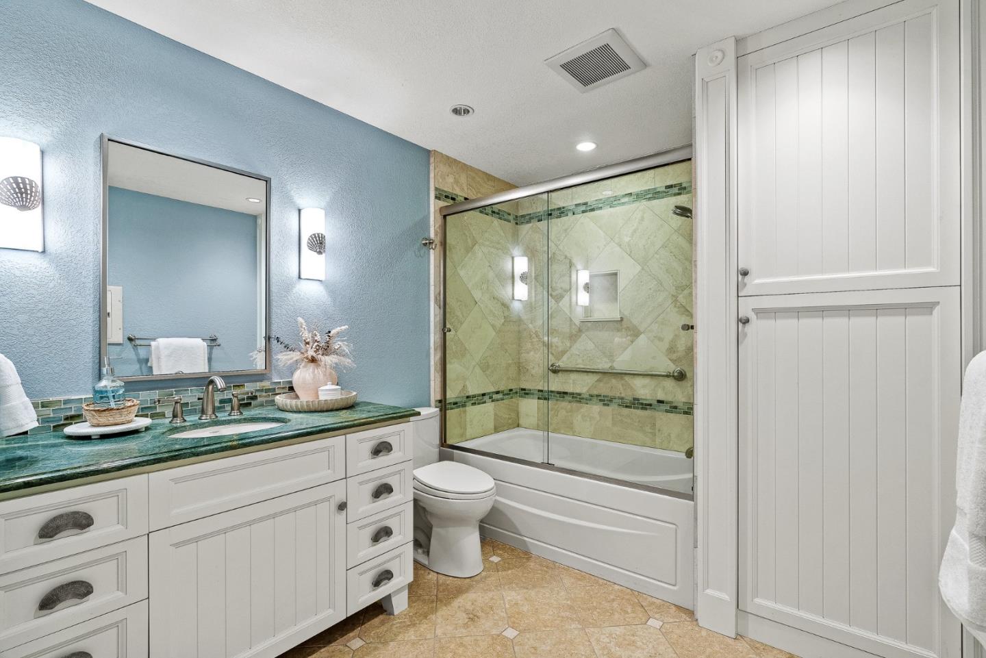 431 Canon Del Sol Watsonville, CA 95076 - Photo 32 of 50 a bathroom with a double vanity sink toilet mirror and shower