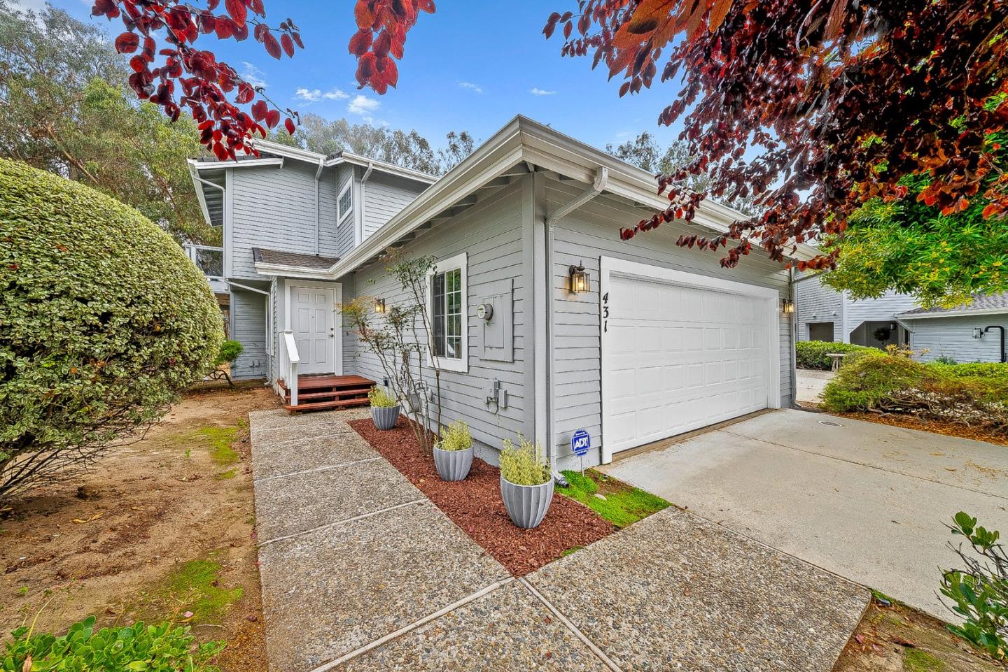 431 Canon Del Sol Watsonville, CA 95076 - Photo 4 of 50 a view of a house with a yard and tree