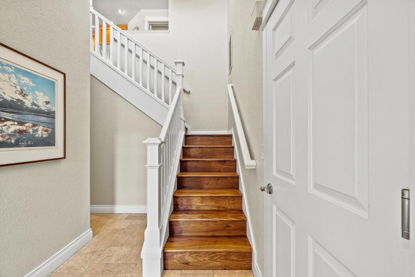 431 Canon Del Sol Watsonville, CA 95076 - Photo 7 of 50 a view of staircase with wooden floor and white walls