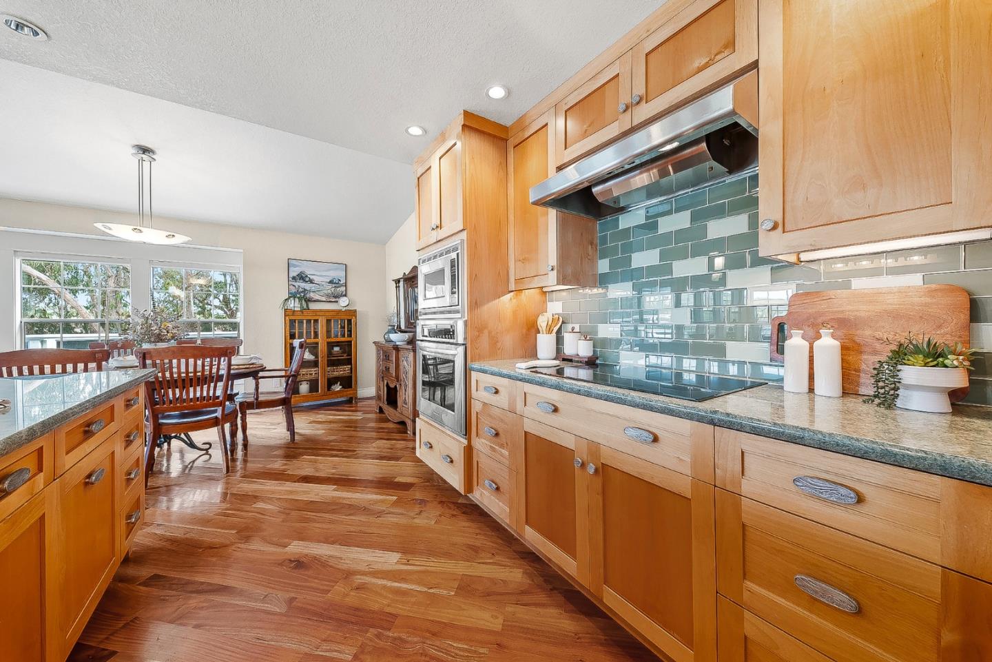 431 Canon Del Sol Watsonville, CA 95076 - Photo 10 of 50 a kitchen with sink cabinets and dining table