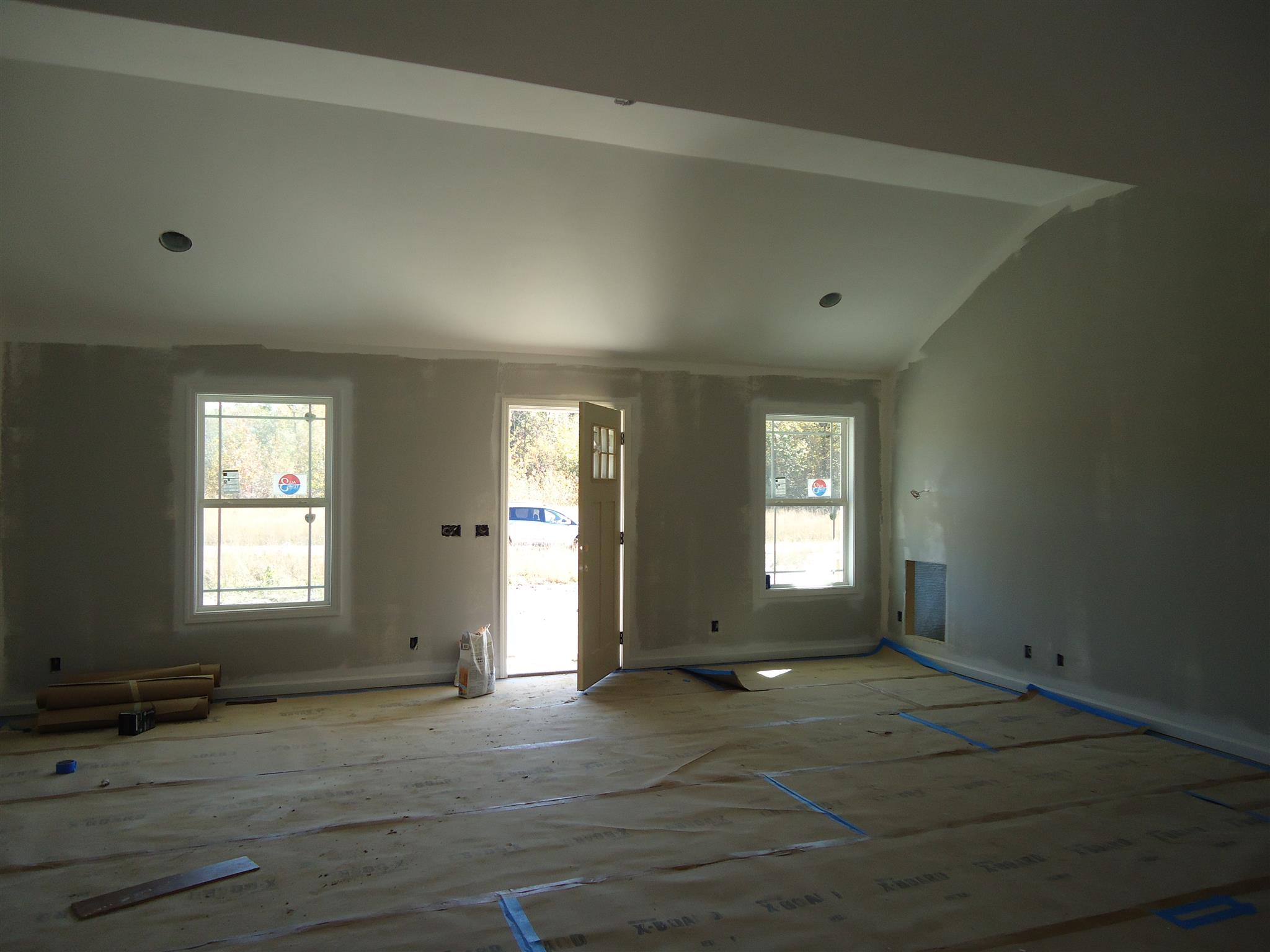100 Ballard Road Manchester, TN 37355 - Photo 3 of 9 an empty room with wooden floor and windows