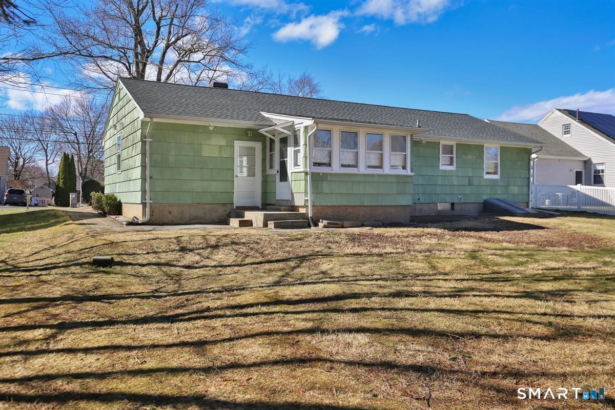 57 Alanby Drive Meriden, CT 06451 - Photo 17 of 20 a front view of a house with a yard