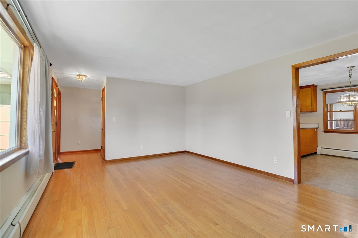 57 Alanby Drive Meriden, CT 06451 - Photo 4 of 20 a view of an empty room with a window