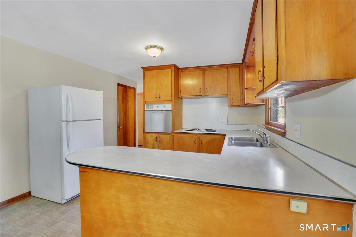 57 Alanby Drive Meriden, CT 06451 - Photo 5 of 20 a view of kitchen and a window