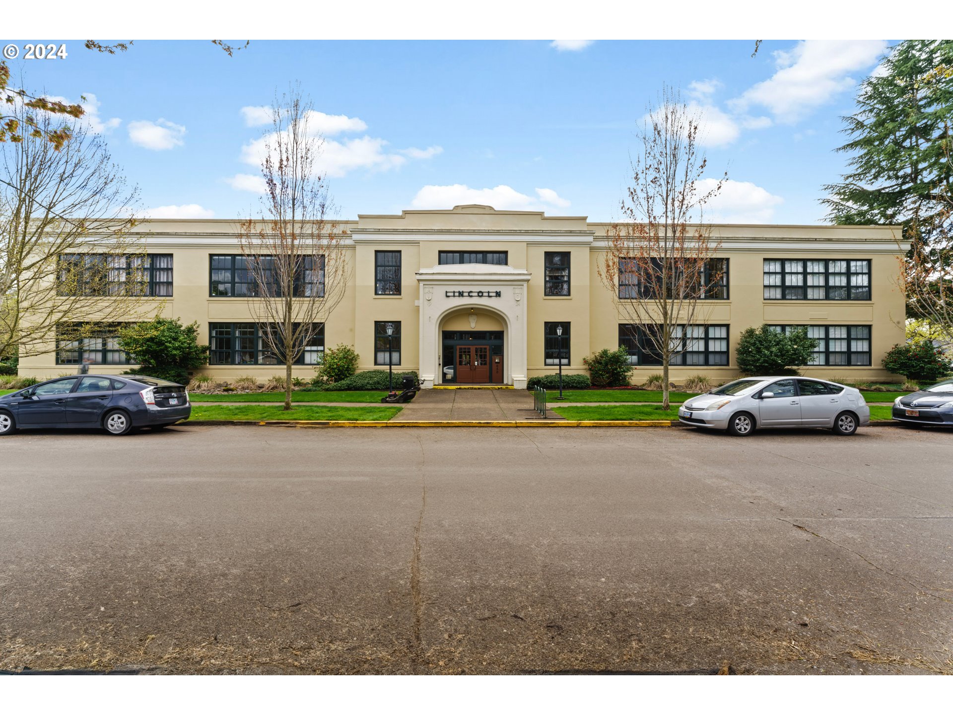 650 West 12th Avenue, Unit 202 Eugene, OR 97402 - Photo 1 of 30 a front view of a building with cars parked