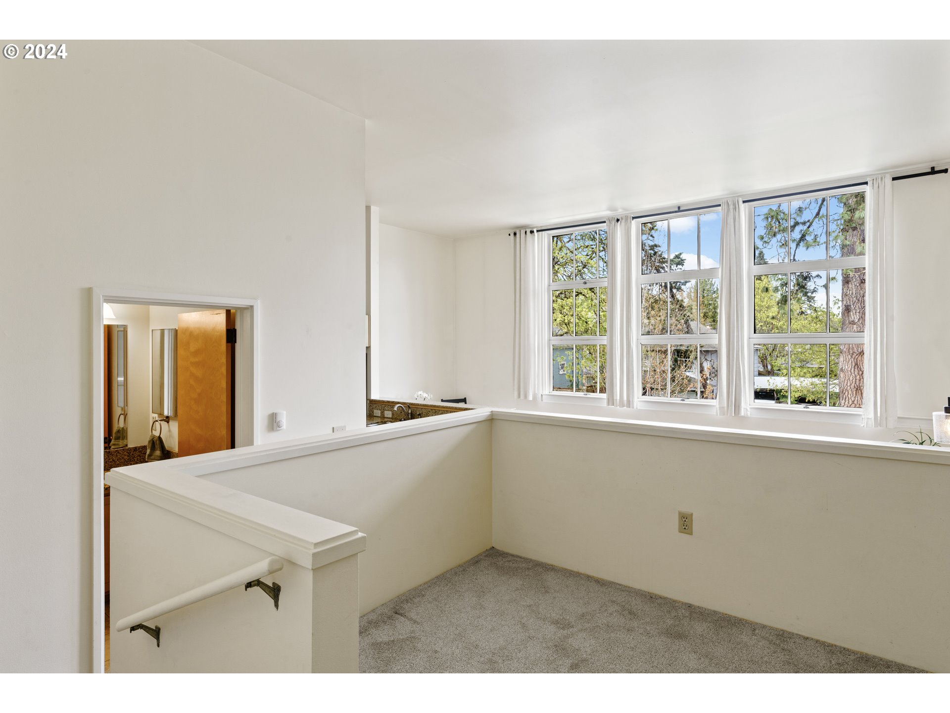 650 West 12th Avenue, Unit 202 Eugene, OR 97402 - Photo 13 of 30 a kitchen with a sink cabinets and wooden floor