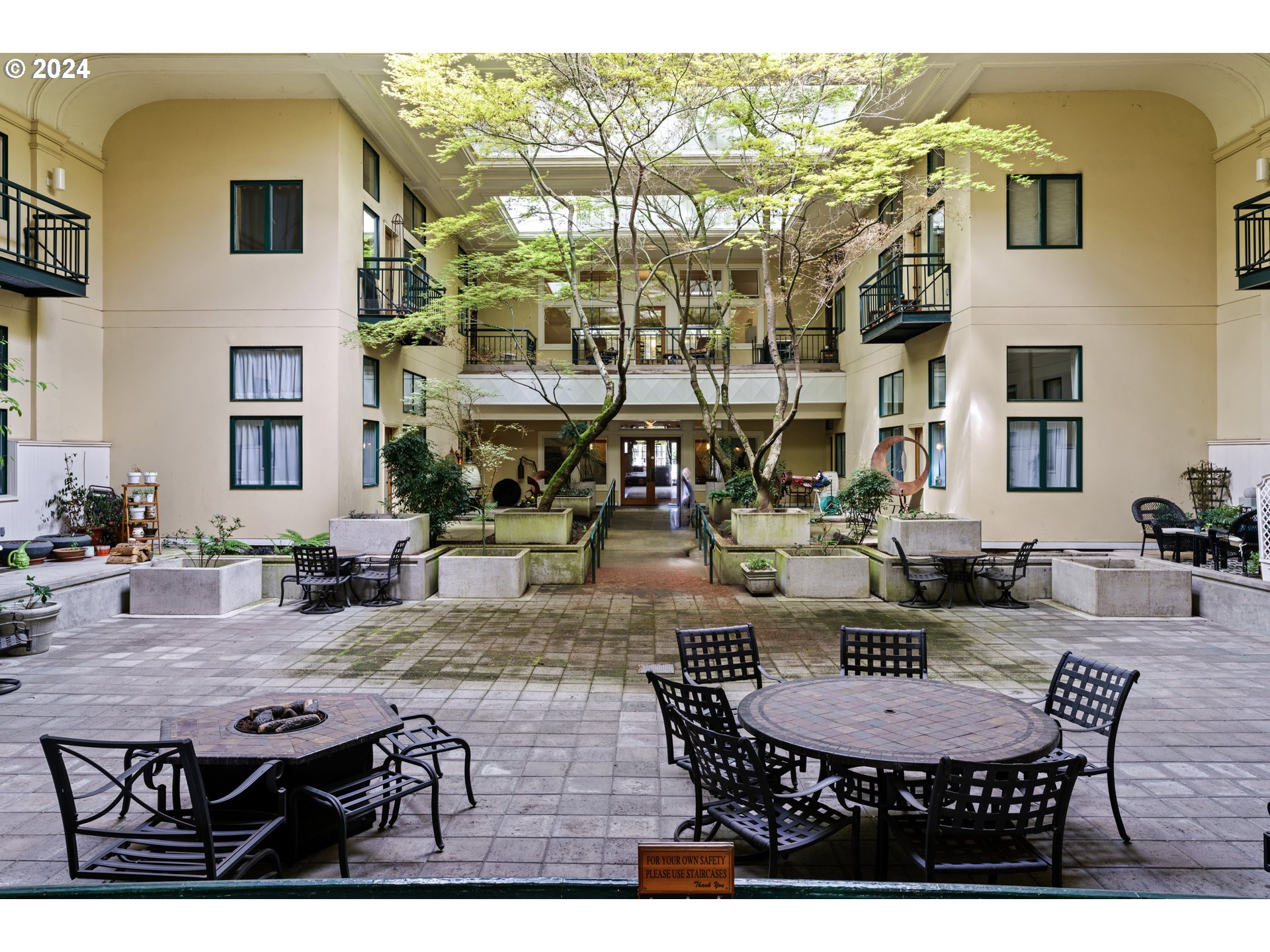 650 West 12th Avenue, Unit 202 Eugene, OR 97402 - Photo 24 of 30 a view of a patio with dining table and chairs