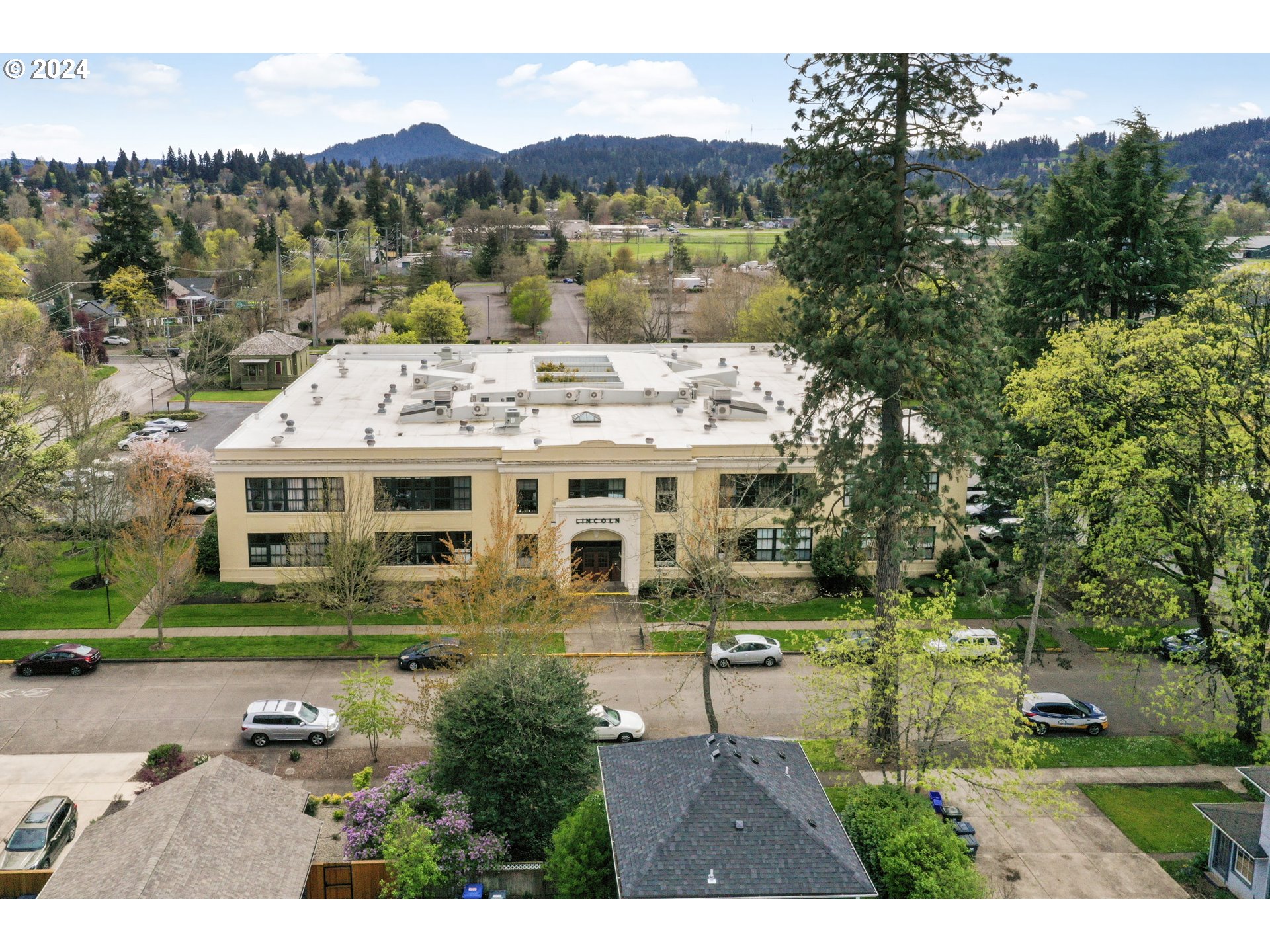 650 West 12th Avenue, Unit 202 Eugene, OR 97402 - Photo 30 of 30 a aerial view of a house with a yard