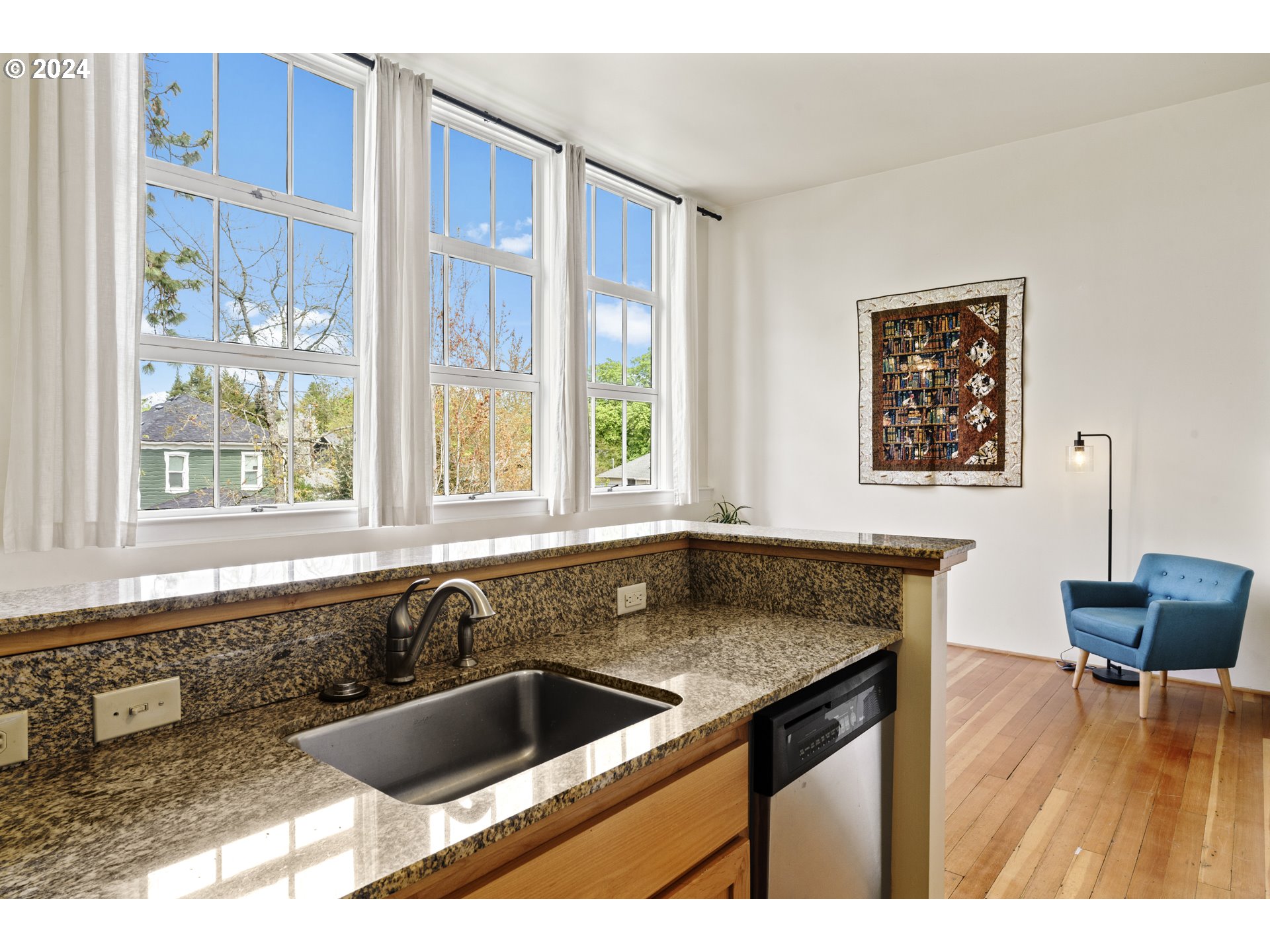650 West 12th Avenue, Unit 202 Eugene, OR 97402 - Photo 4 of 30 a kitchen with a sink and a large window