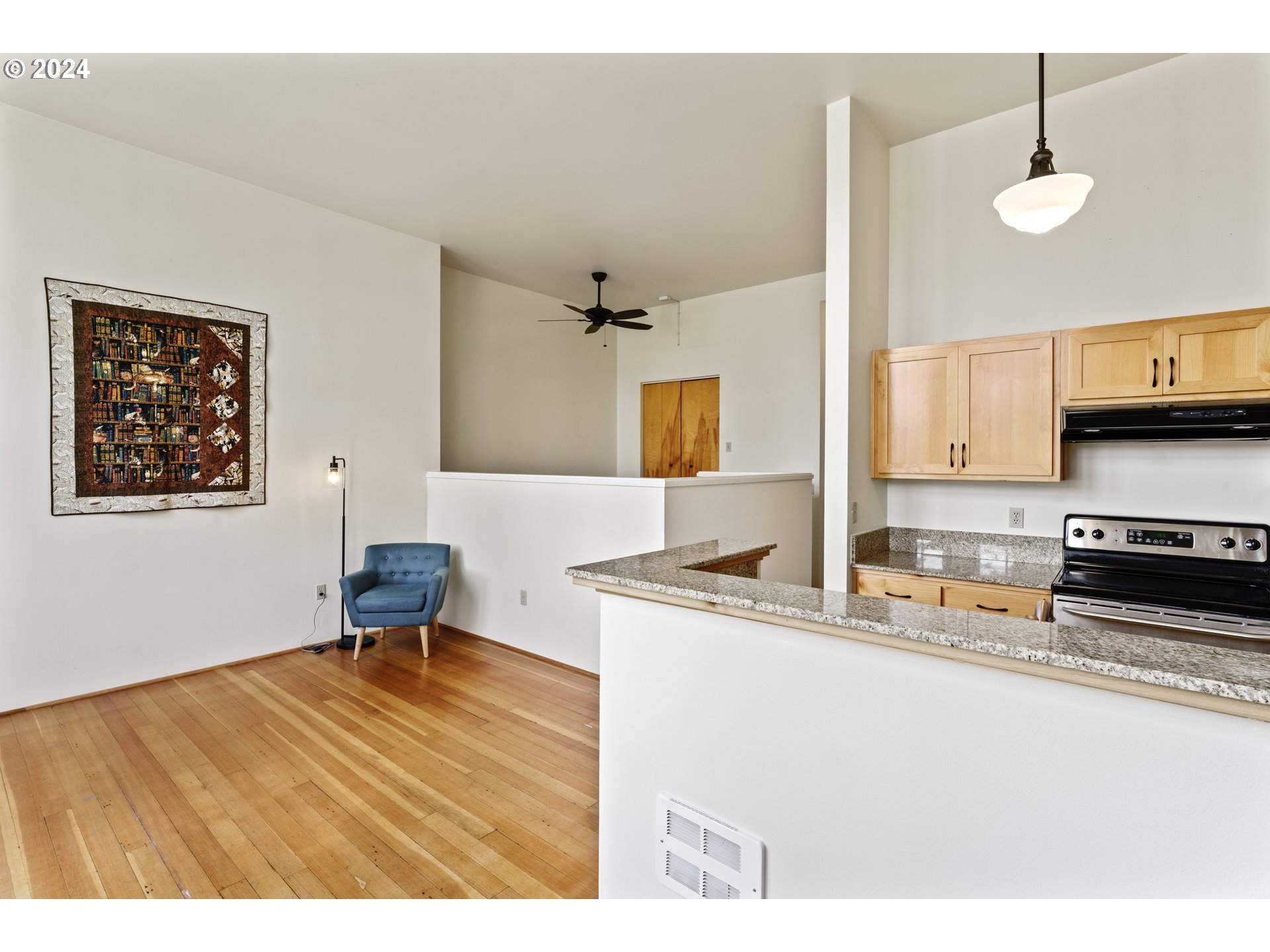 650 West 12th Avenue, Unit 202 Eugene, OR 97402 - Photo 7 of 30 a kitchen view with wooden floor table and chairs