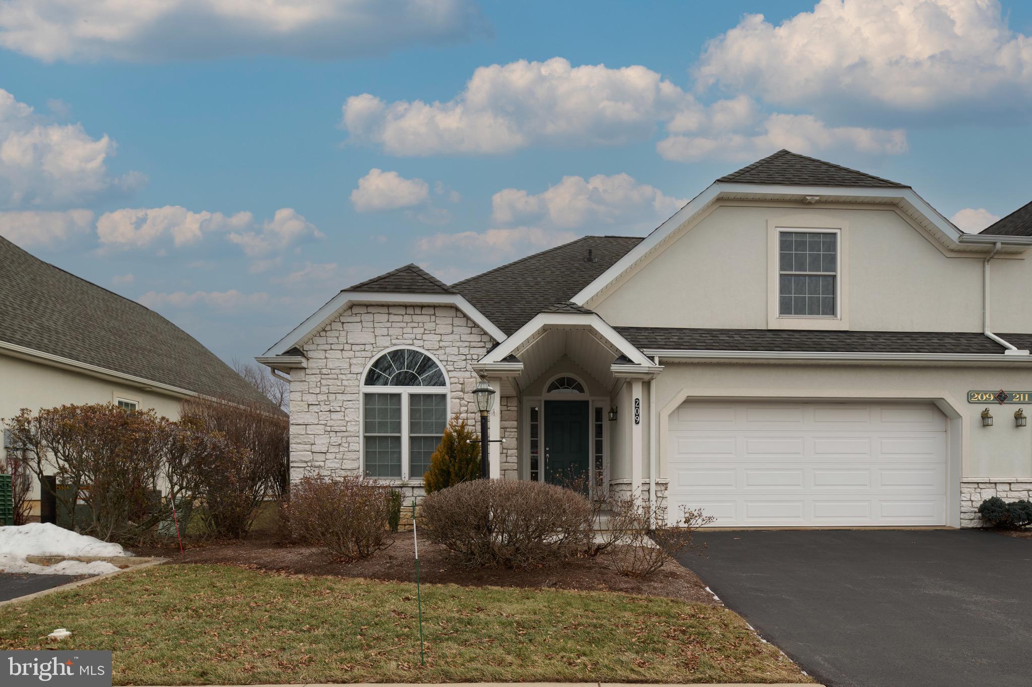 3222 Shellers Bend, Unit 209 State College, PA 16801 - Photo 1 of 76 a front view of a house with garden