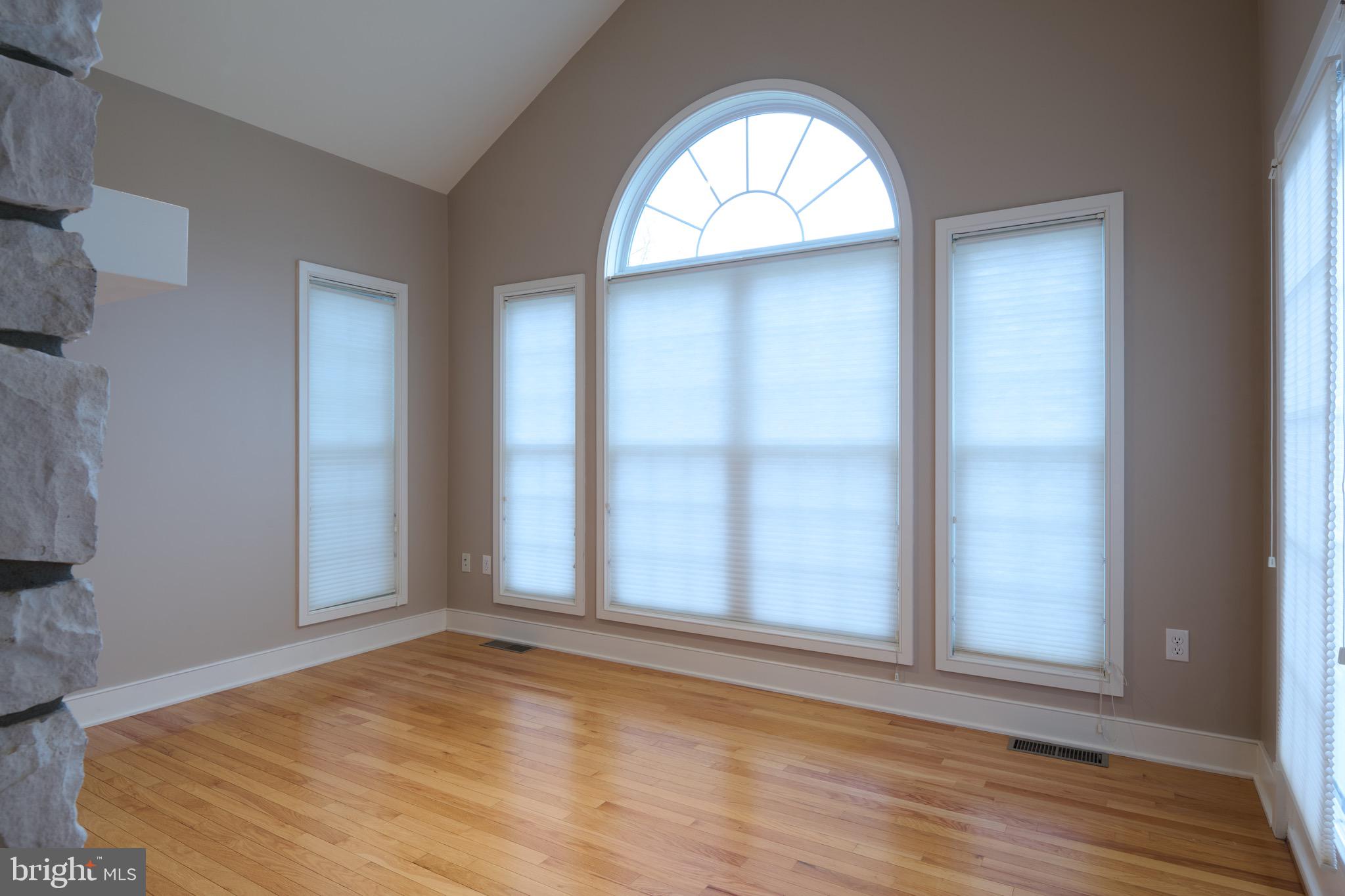 3222 Shellers Bend, Unit 209 State College, PA 16801 - Photo 16 of 76 a view of empty room with wooden floor and fan