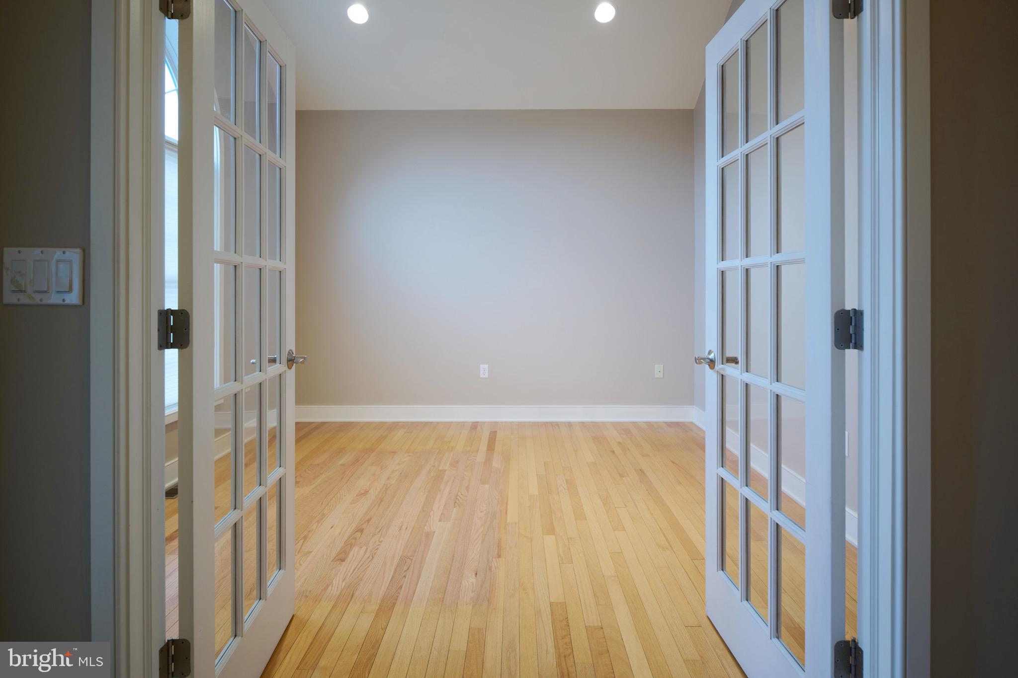 3222 Shellers Bend, Unit 209 State College, PA 16801 - Photo 2 of 76 a view of a hallway with wooden floor and staircase