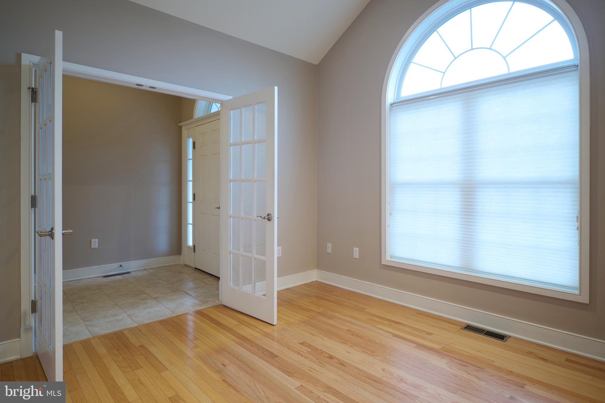 3222 Shellers Bend, Unit 209 State College, PA 16801 - Photo 3 of 76 an empty room with wooden floor closet and windows