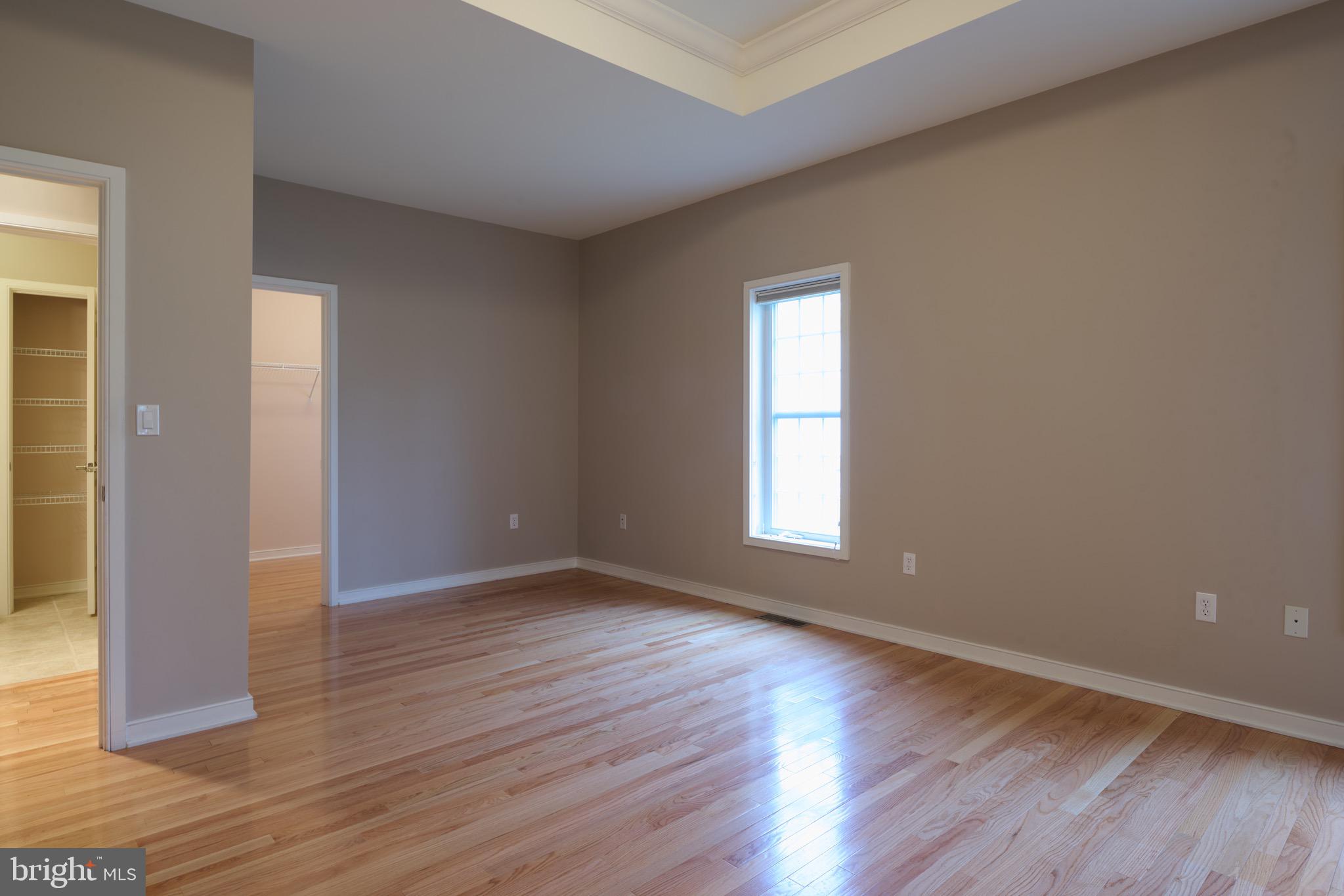 3222 Shellers Bend, Unit 209 State College, PA 16801 - Photo 31 of 76 an empty room with wooden floor and windows