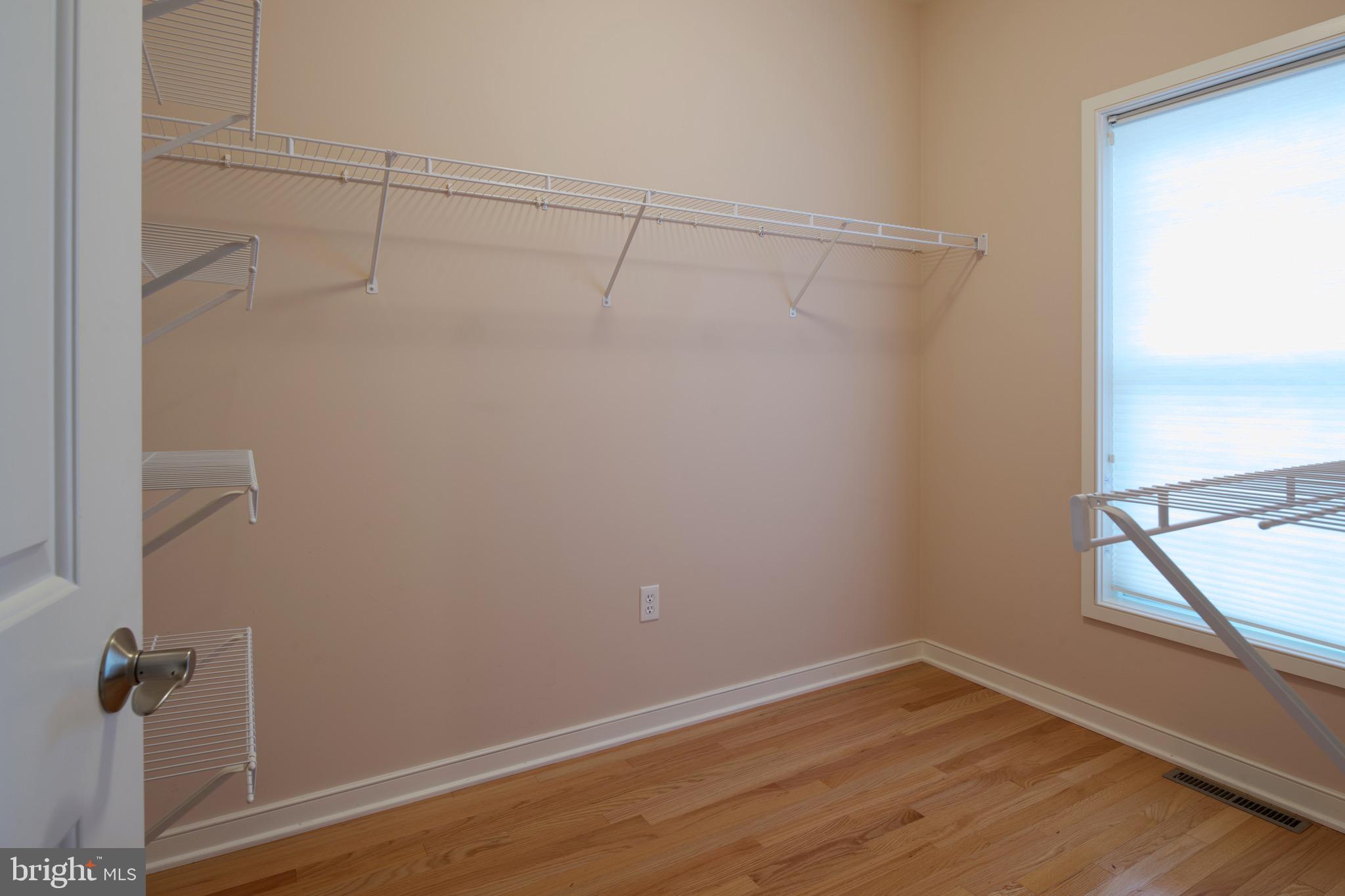 3222 Shellers Bend, Unit 209 State College, PA 16801 - Photo 34 of 76 a view of a room with wooden floor and fan