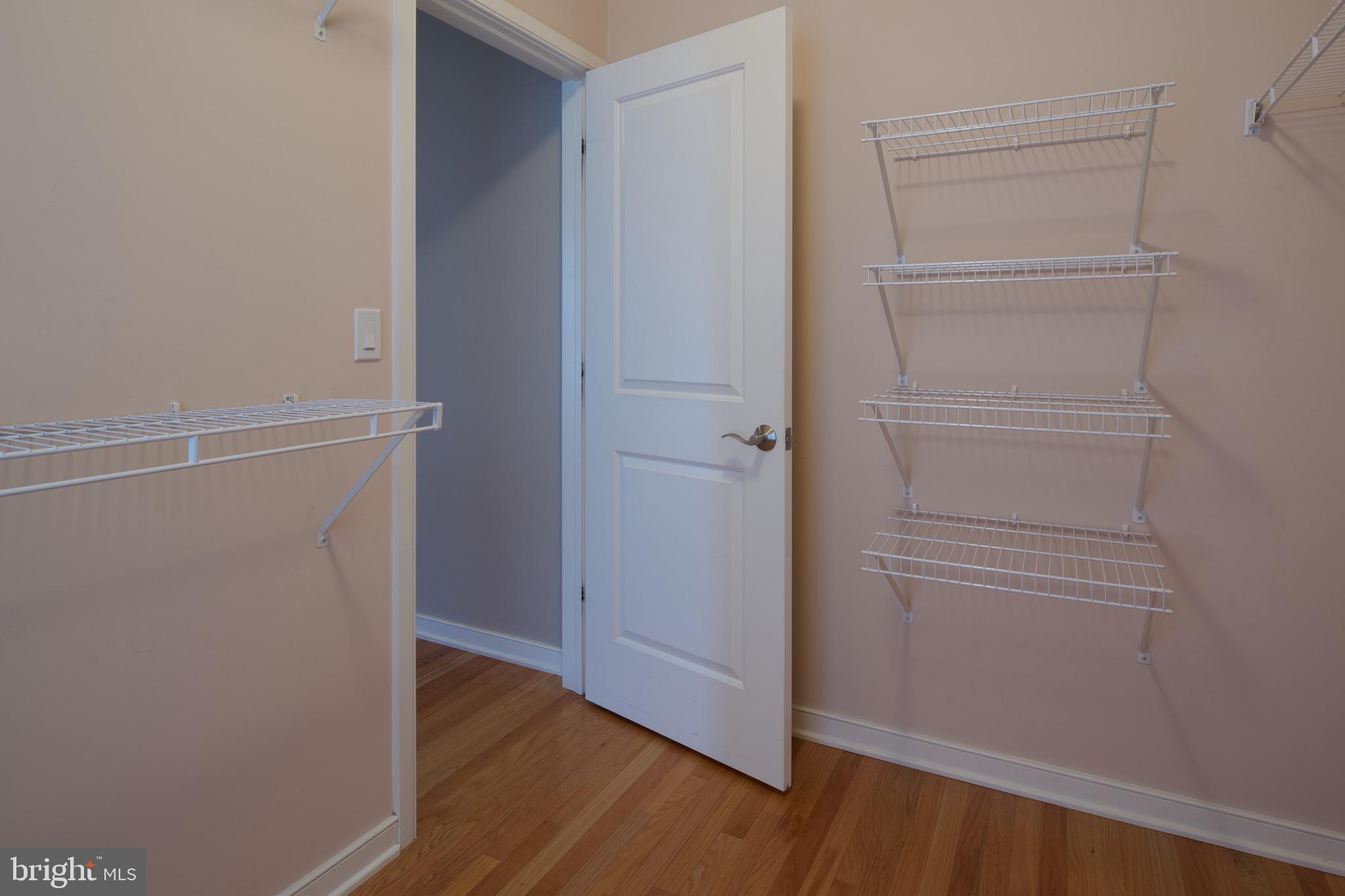 3222 Shellers Bend, Unit 209 State College, PA 16801 - Photo 35 of 76 a view of walk in closet with empty racks