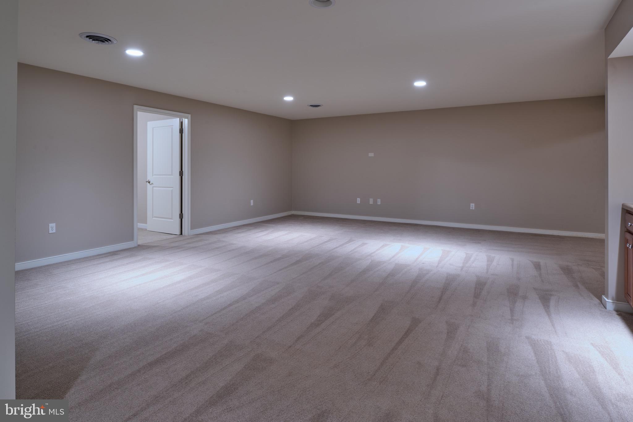 3222 Shellers Bend, Unit 209 State College, PA 16801 - Photo 50 of 76 an empty room with wooden floor and windows