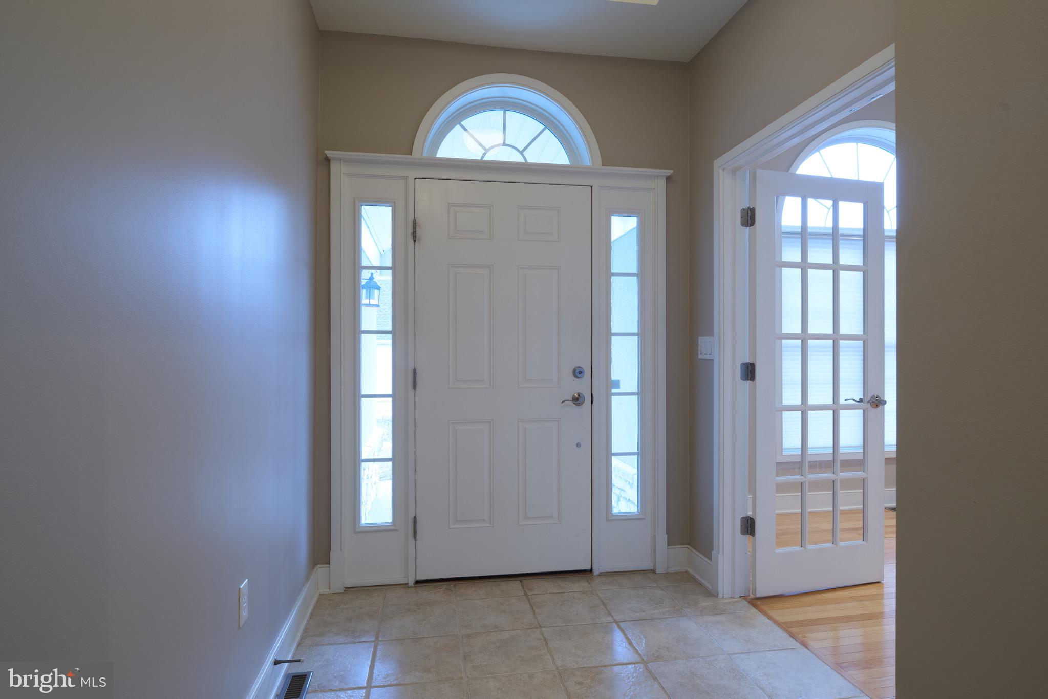 3222 Shellers Bend, Unit 209 State College, PA 16801 - Photo 5 of 76 an empty room with windows mirror and windows