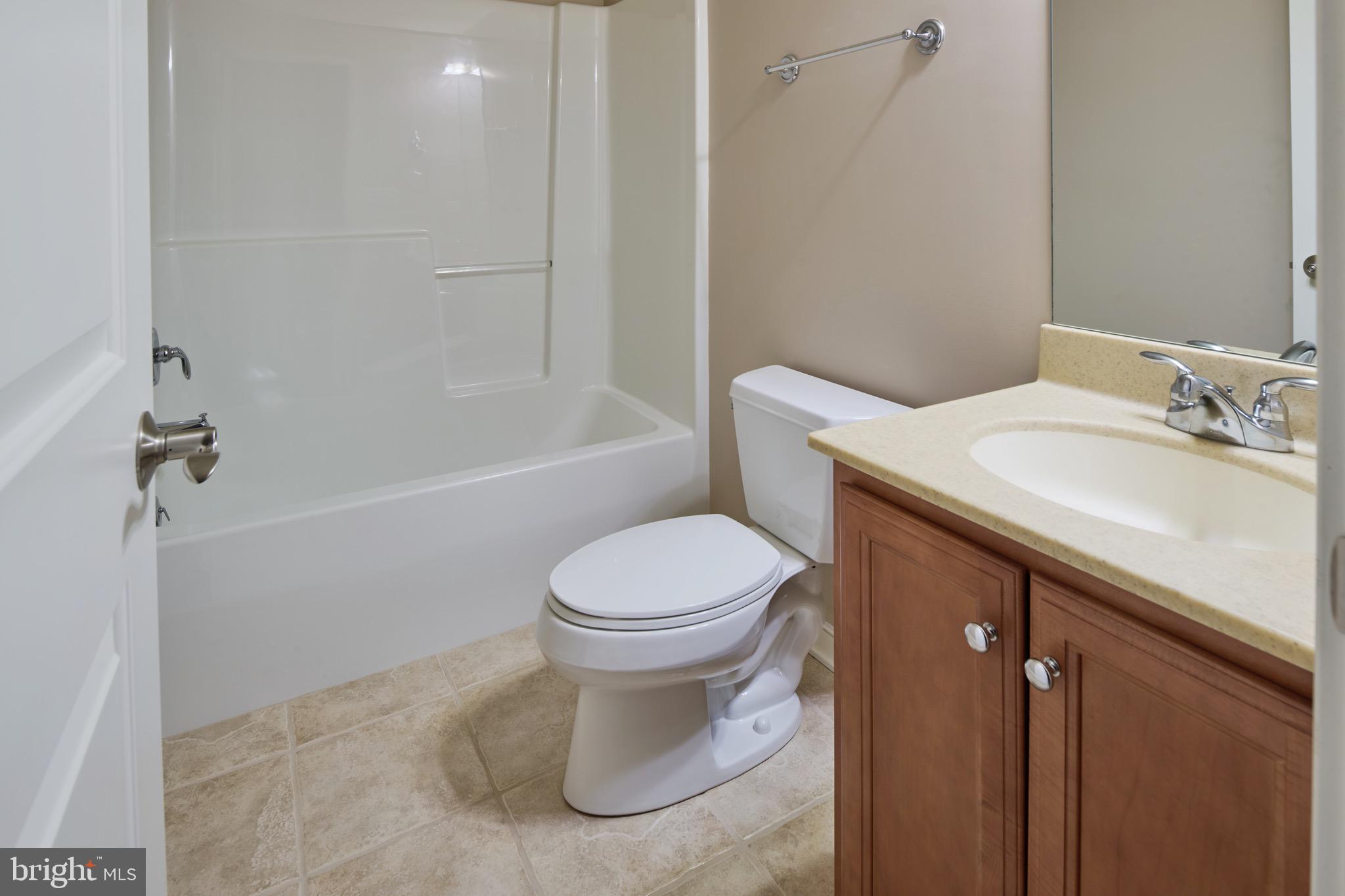 3222 Shellers Bend, Unit 209 State College, PA 16801 - Photo 55 of 76 a bathroom with a sink a toilet and shower
