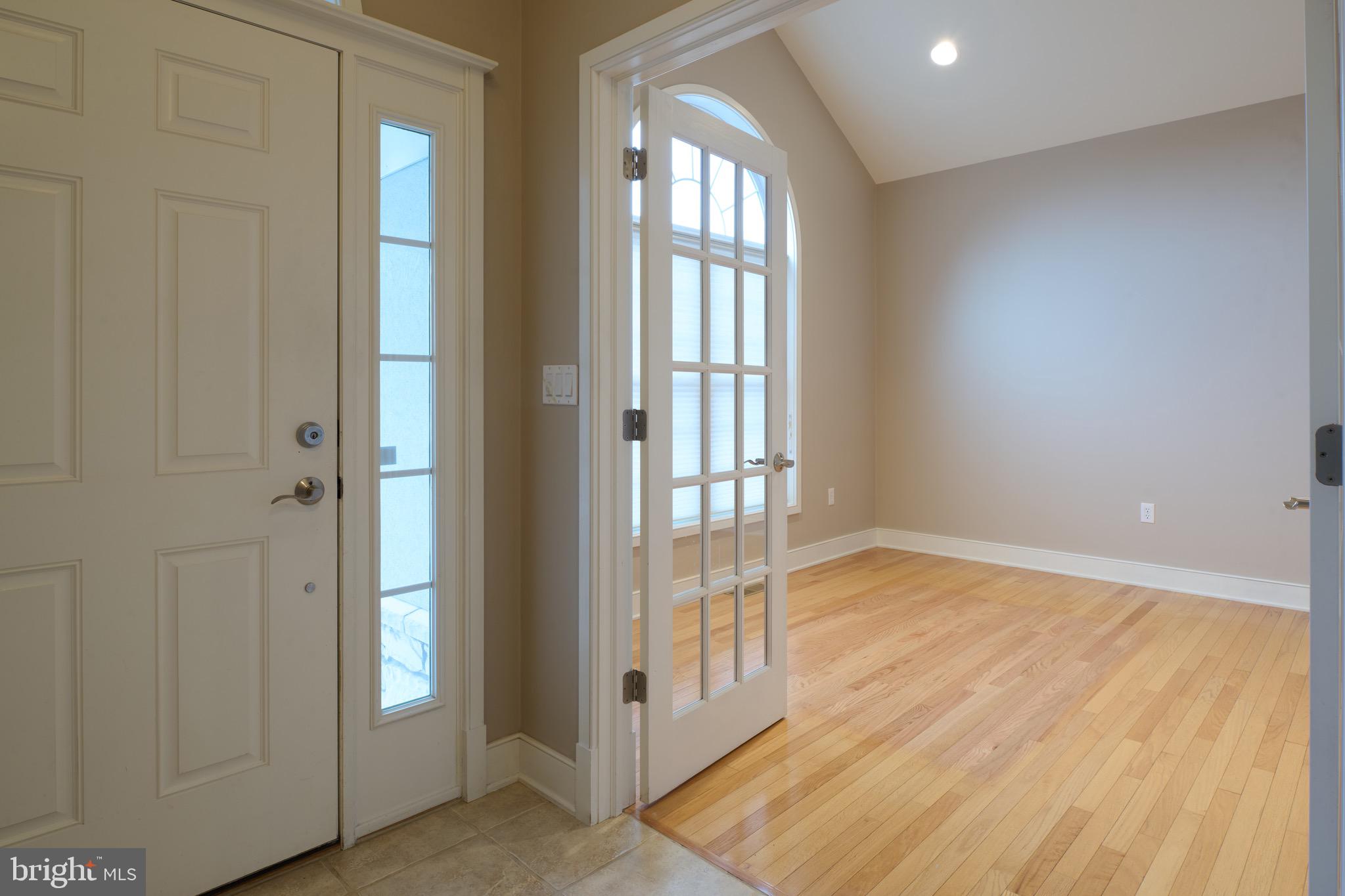 3222 Shellers Bend, Unit 209 State College, PA 16801 - Photo 6 of 76 an empty room with wooden floor and windows