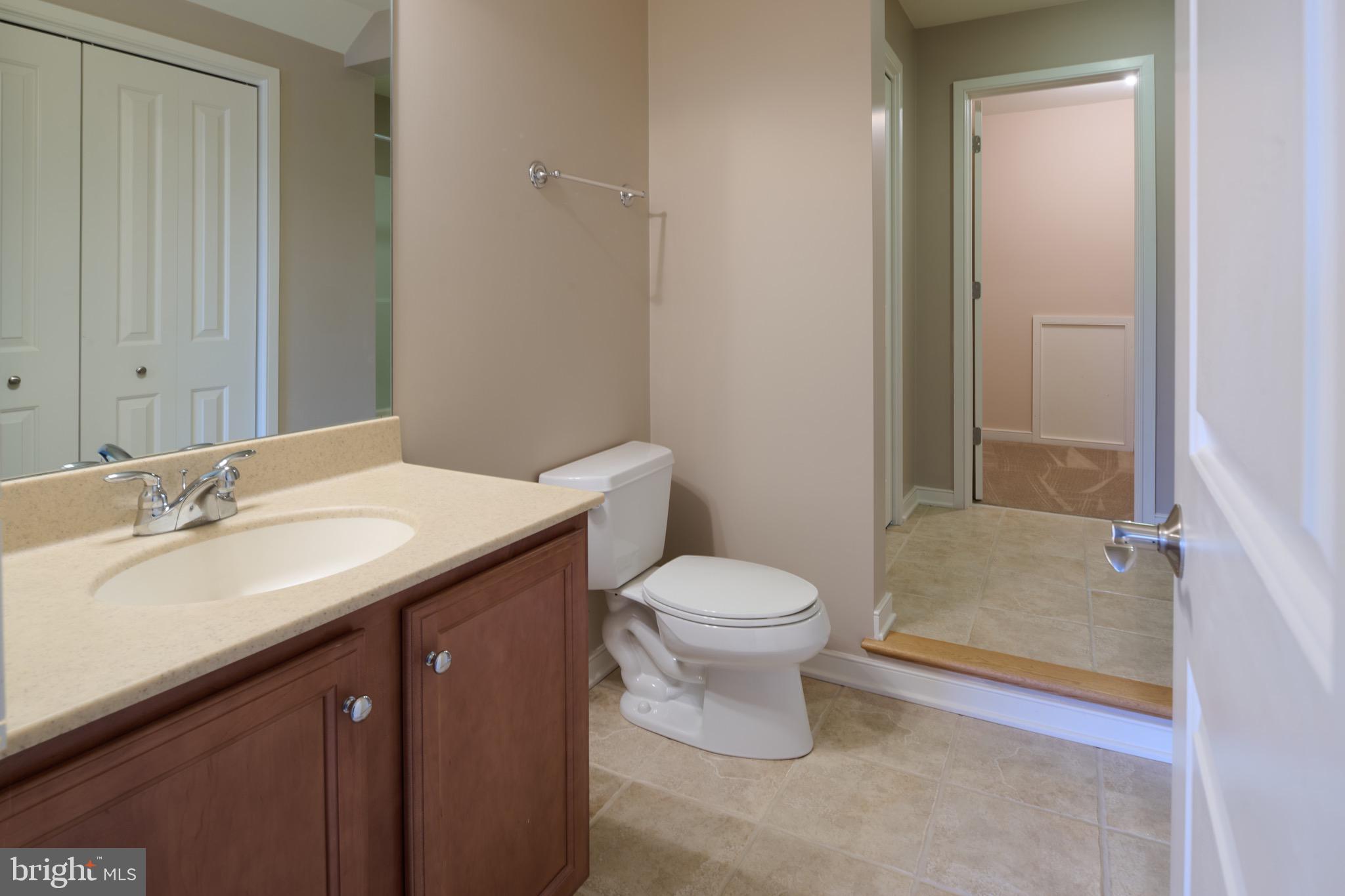 3222 Shellers Bend, Unit 209 State College, PA 16801 - Photo 62 of 76 a bathroom with a sink a toilet and shower