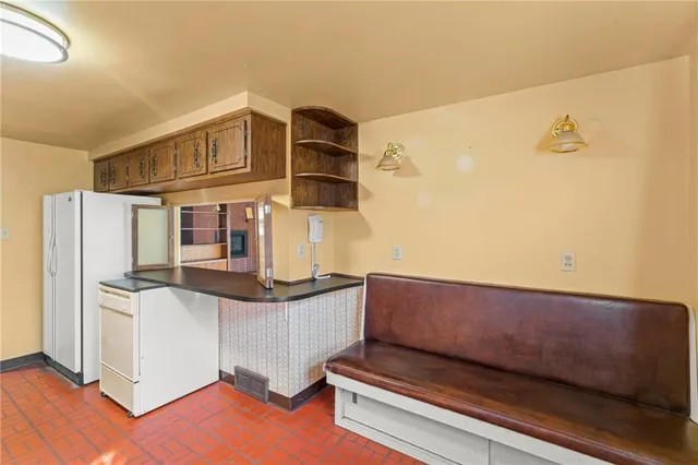 a view of kitchen and utility room with wooden floor