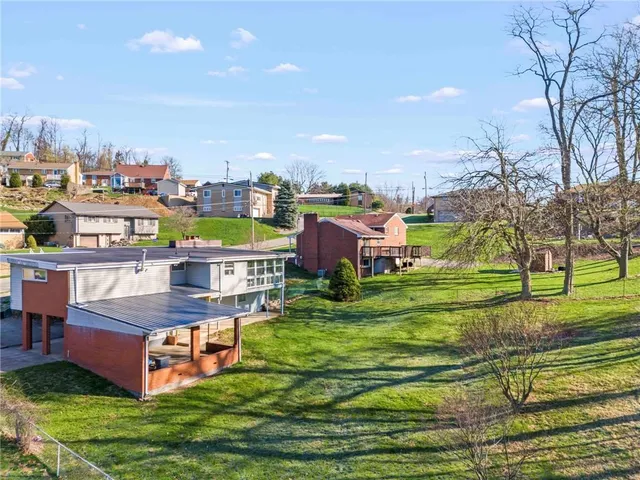 an aerial view of a city with lots of residential buildings