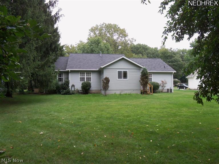 210 Birch Road Painesville, OH 44077 - Photo 24 of 25 THE ATTRACTIVE BACKYARD WITH ITS MATURE TREES ADDS BEAUTY AND MAJESTY TO THE LANDSCAPE. THERE IS PLENTY OF ROOM FOR ALL THOSE FUN SUMMERTIME OUTDOOR ACTIVITIES.