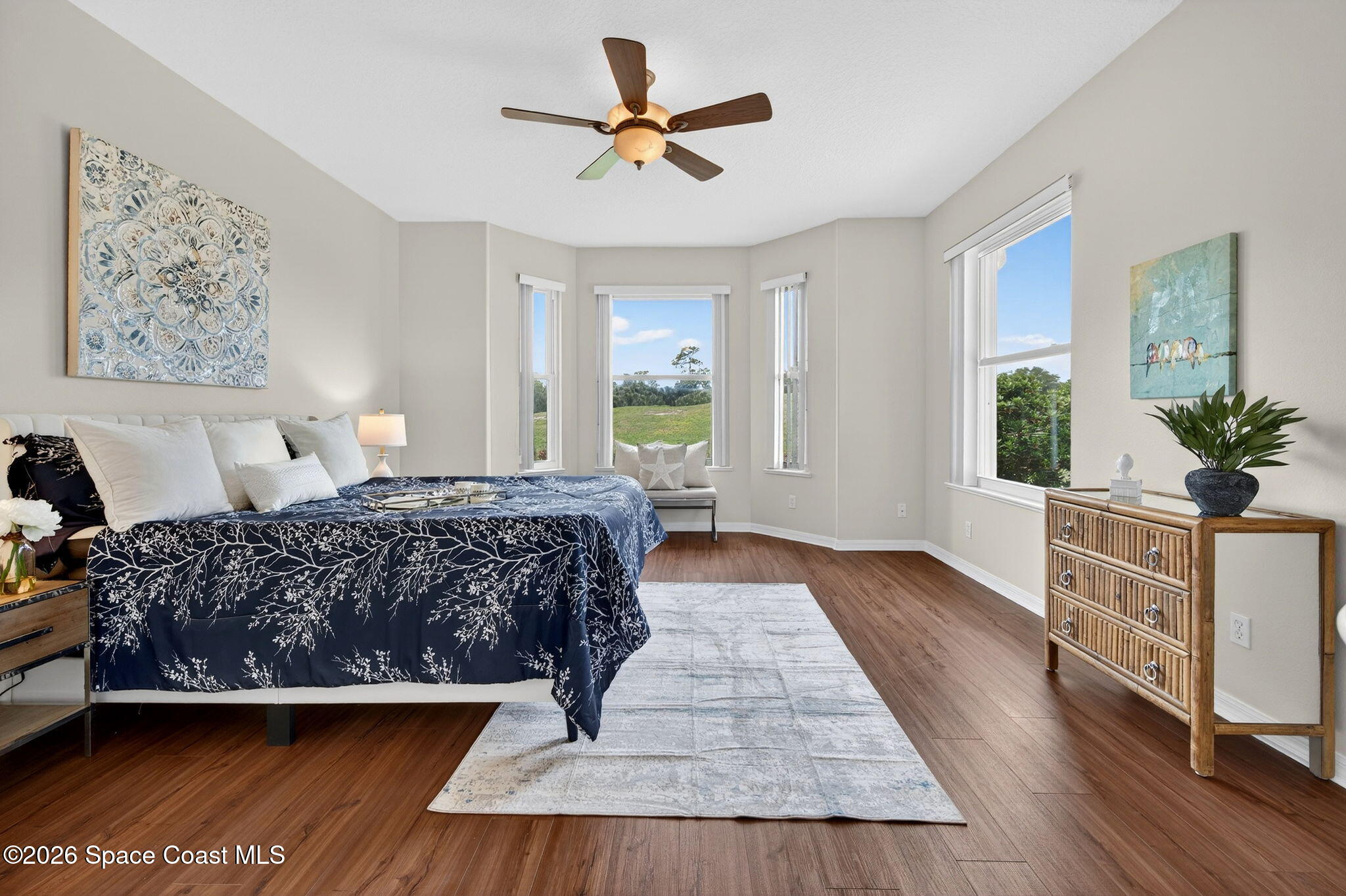 4331 Aberdeen Circle Rockledge, FL 32955 - Photo 14 of 36 a bedroom with a large bed mirror and window