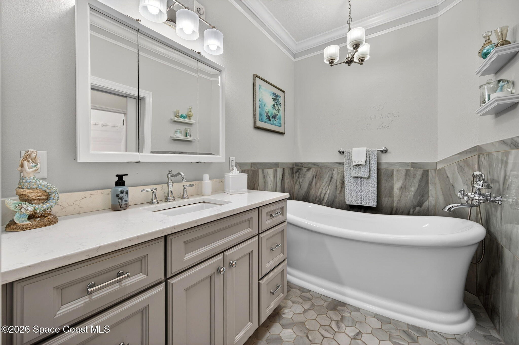 4331 Aberdeen Circle Rockledge, FL 32955 - Photo 15 of 36 a bathroom with a toilet a sink and mirror