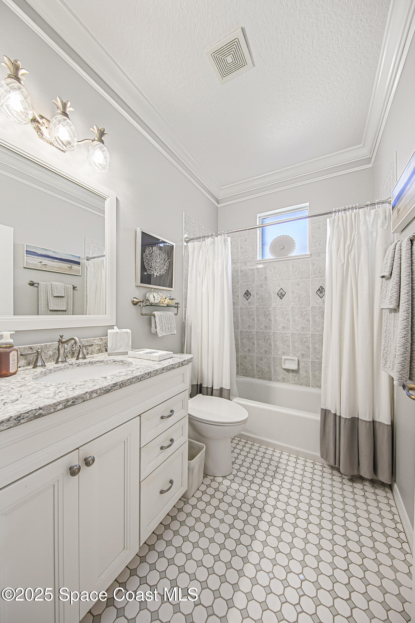 4331 Aberdeen Circle Rockledge, FL 32955 - Photo 16 of 63 a bathroom with a granite countertop sink a toilet a mirror and shower