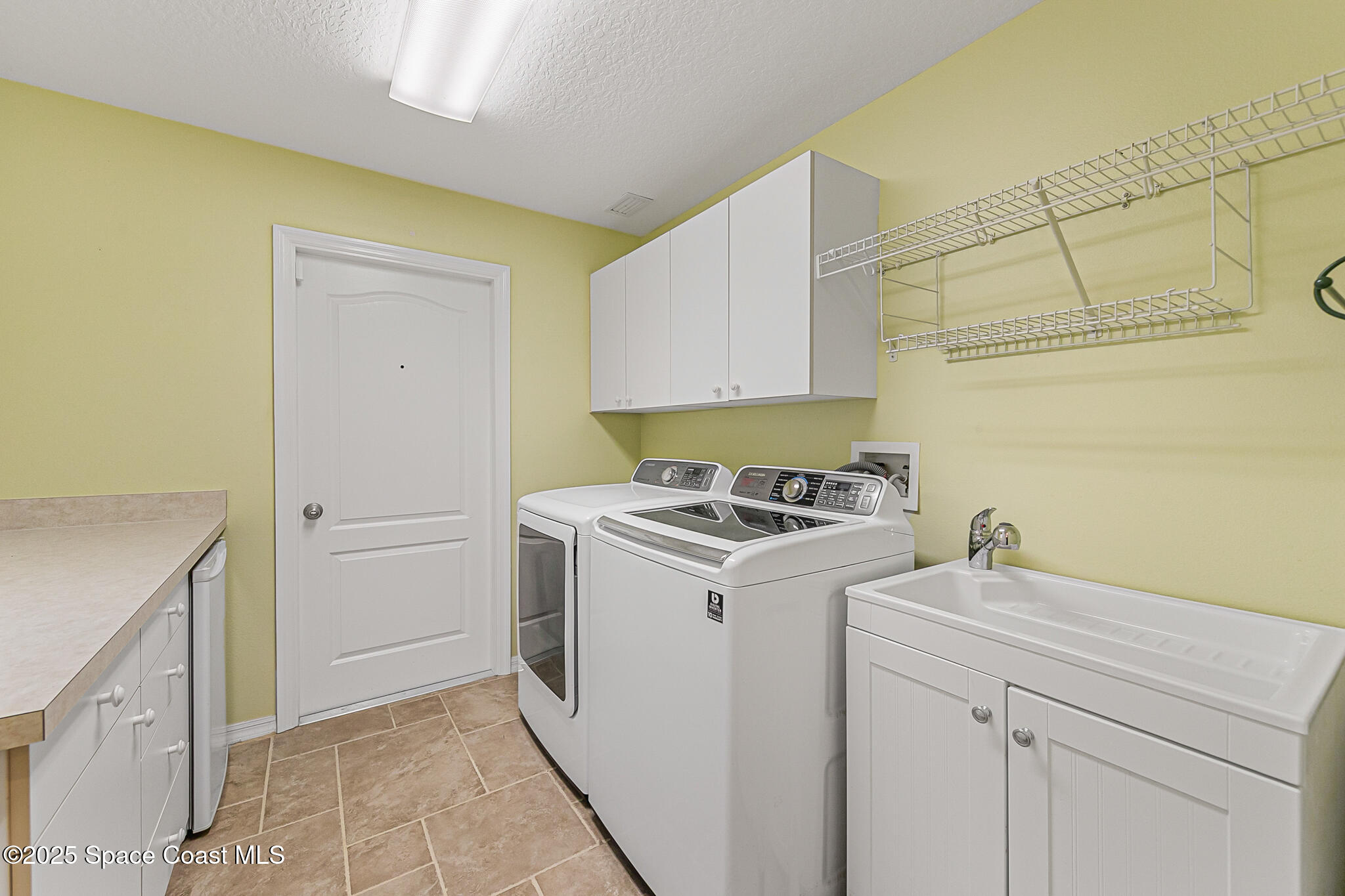 4331 Aberdeen Circle Rockledge, FL 32955 - Photo 21 of 63 a view of a storage and utility room with washer and dryer