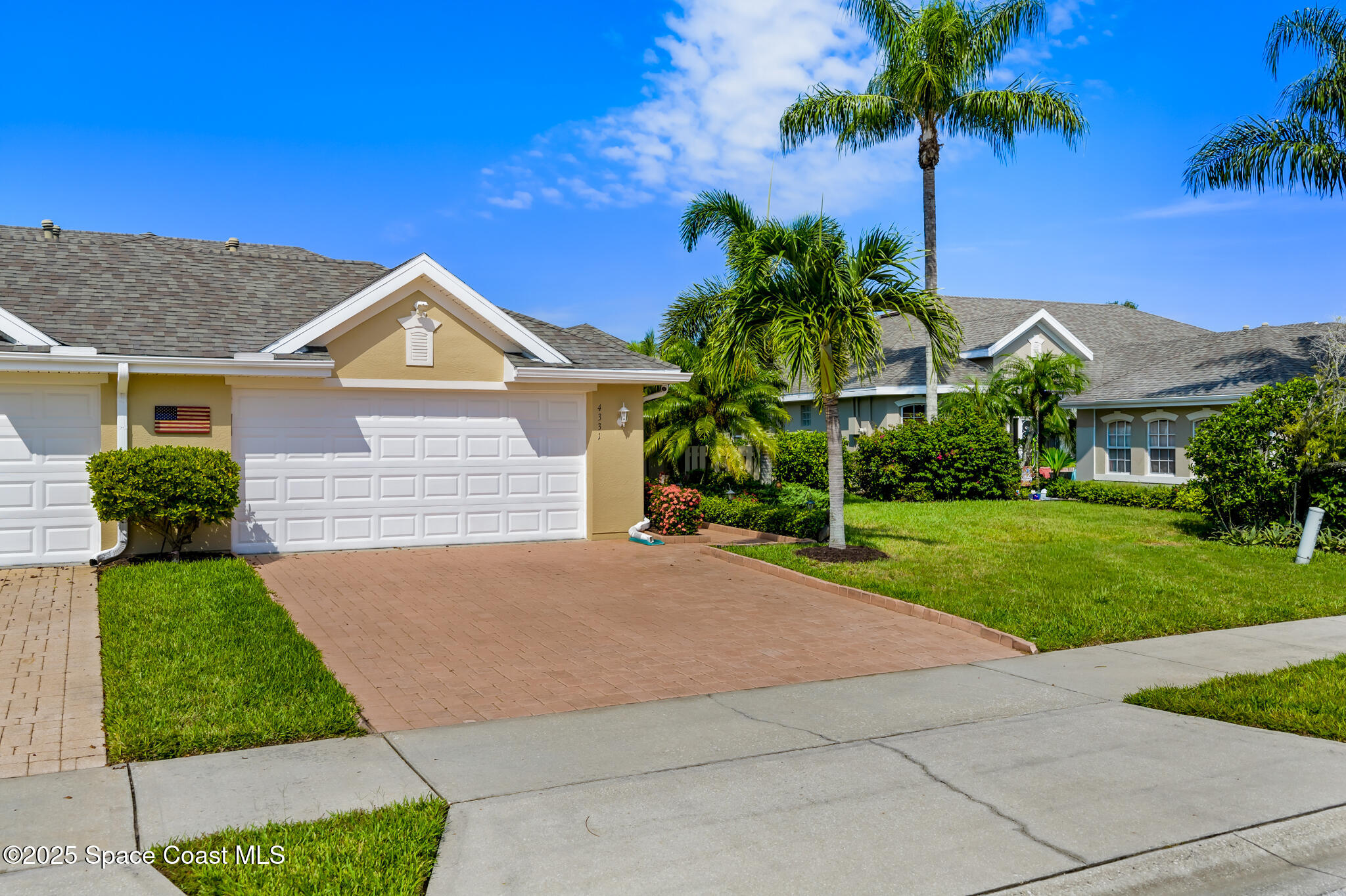 4331 Aberdeen Circle Rockledge, FL 32955 - Photo 37 of 63 a front view of a house with a yard and garage