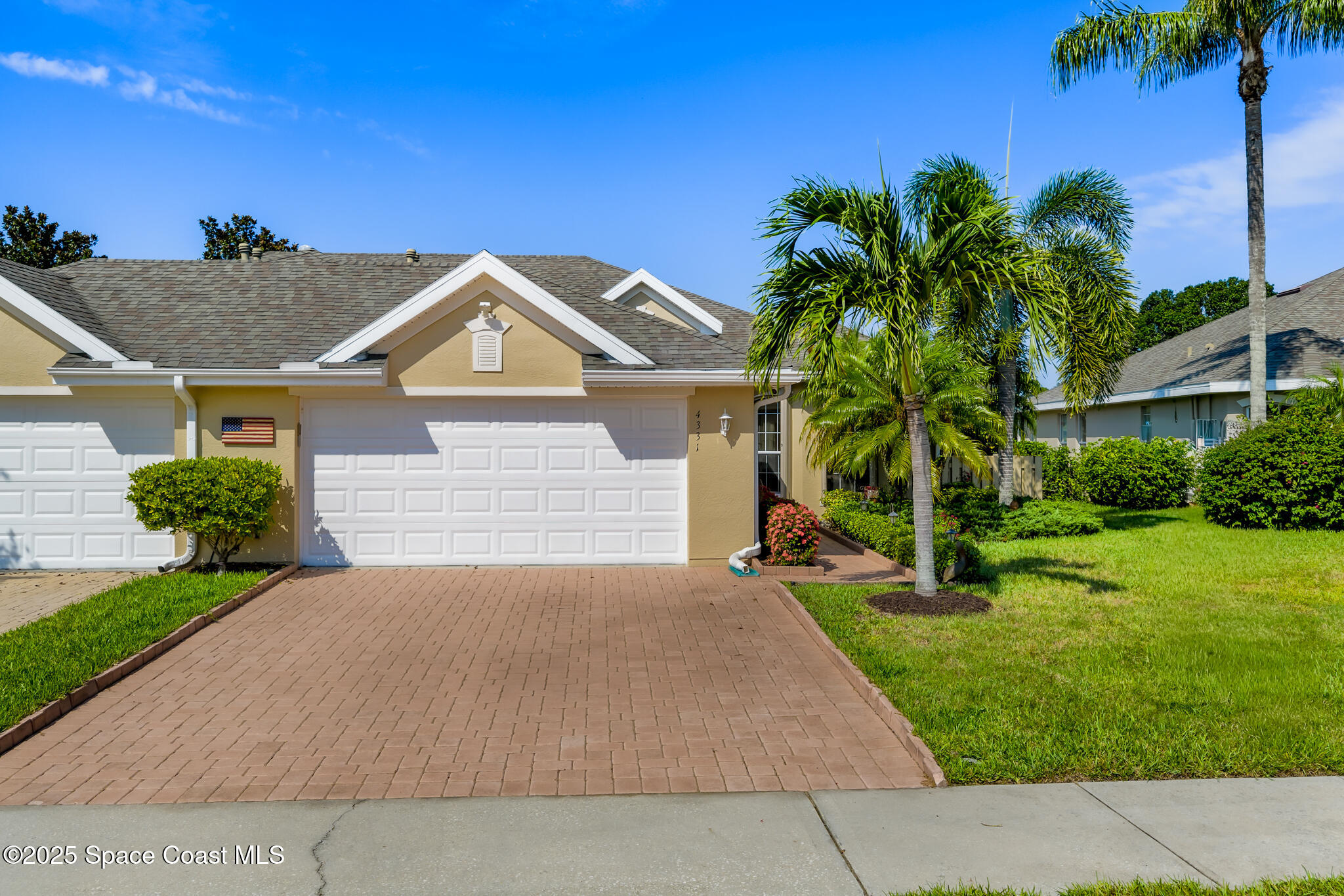 4331 Aberdeen Circle Rockledge, FL 32955 - Photo 57 of 63 a front view of a house with a yard and potted plants