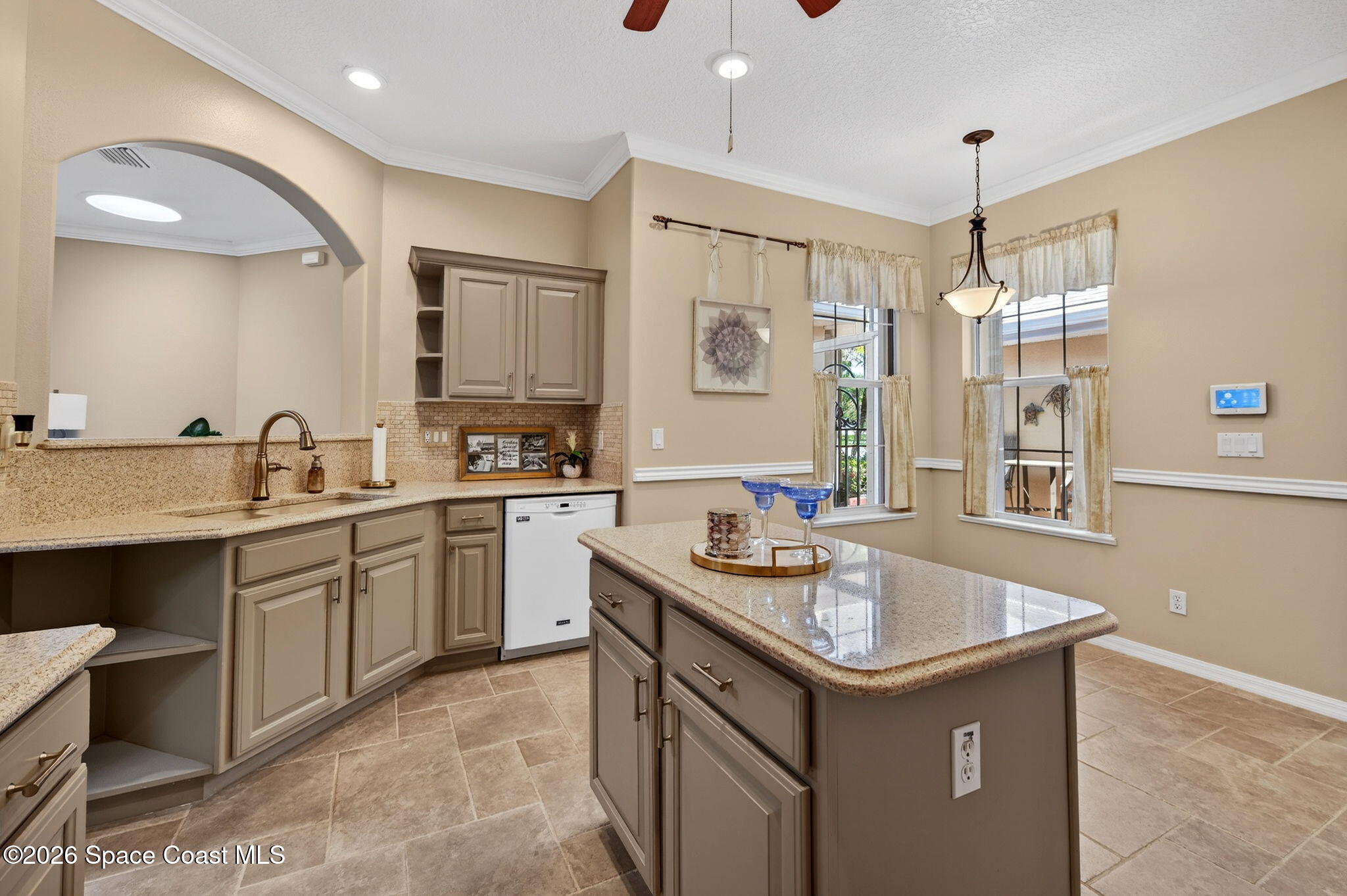4331 Aberdeen Circle Rockledge, FL 32955 - Photo 10 of 36 a kitchen with a sink stove and microwave