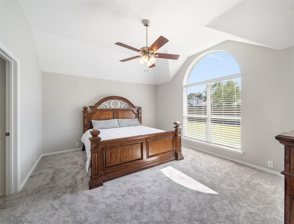 19715 Youpon Leaf Way Houston, TX 77084 - Photo 14 of 20 a bedroom with a bed and a large window