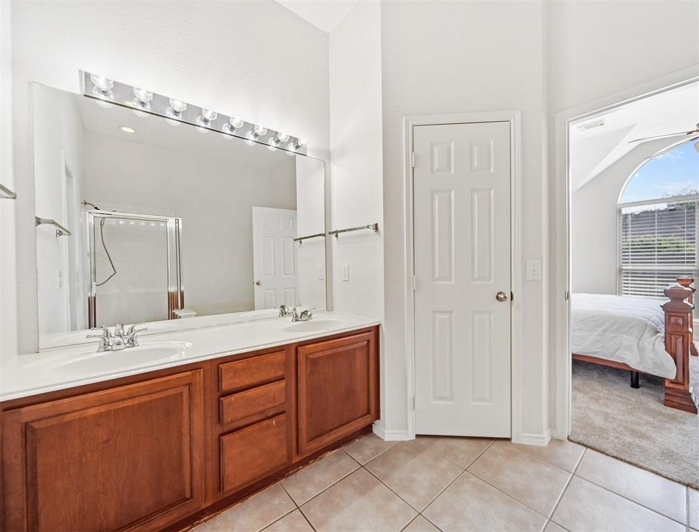 19715 Youpon Leaf Way Houston, TX 77084 - Photo 15 of 20 a spacious bathroom with a double vanity sink mirror and shower
