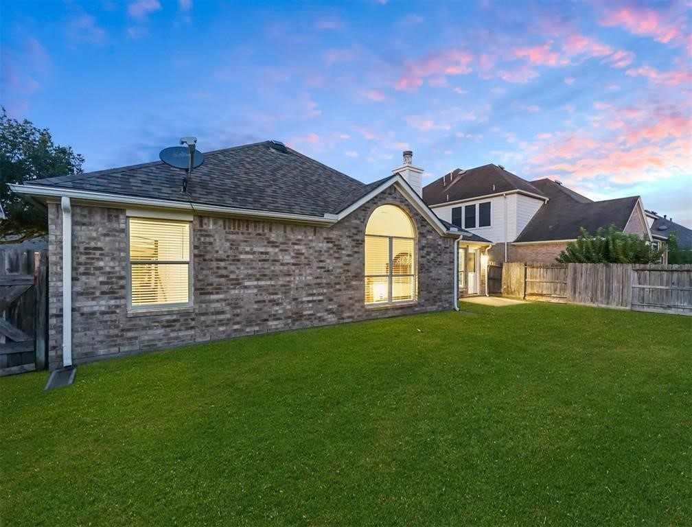 19715 Youpon Leaf Way Houston, TX 77084 - Photo 19 of 20 a front view of a house with a garden