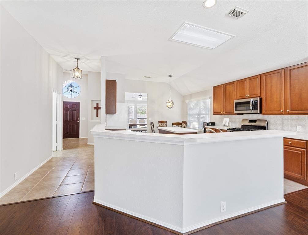 19715 Youpon Leaf Way Houston, TX 77084 - Photo 6 of 20 a kitchen with stainless steel appliances granite countertop a refrigerator sink and cabinets