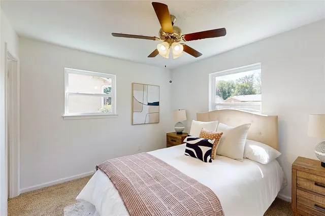 a bedroom with a bed and window