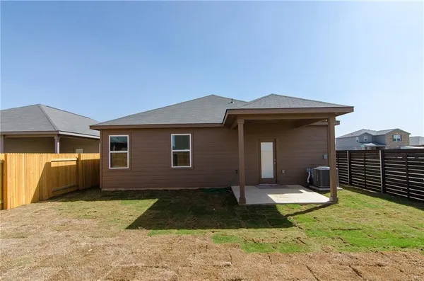 a house view with a backyard space